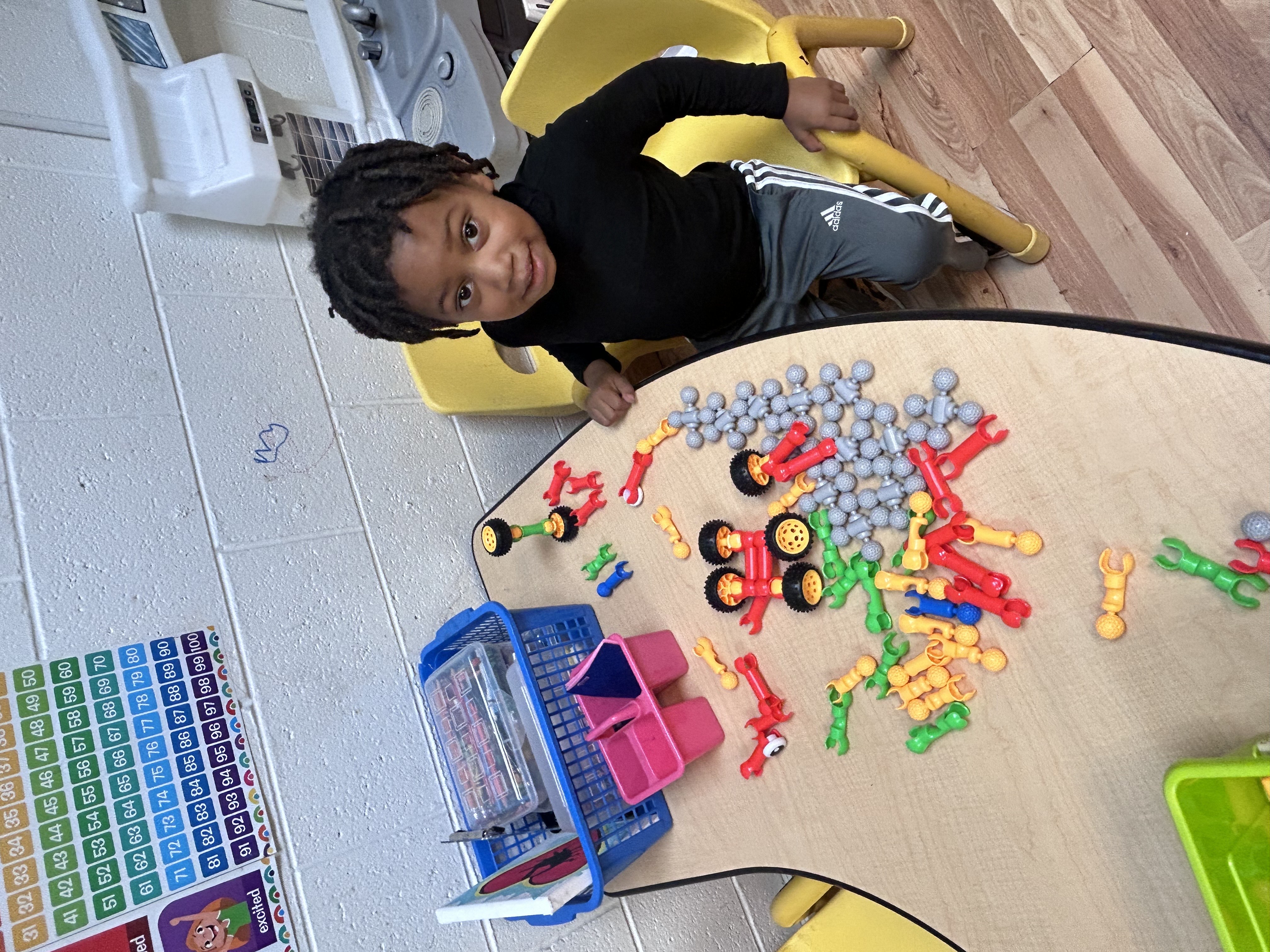 Child playing with robot